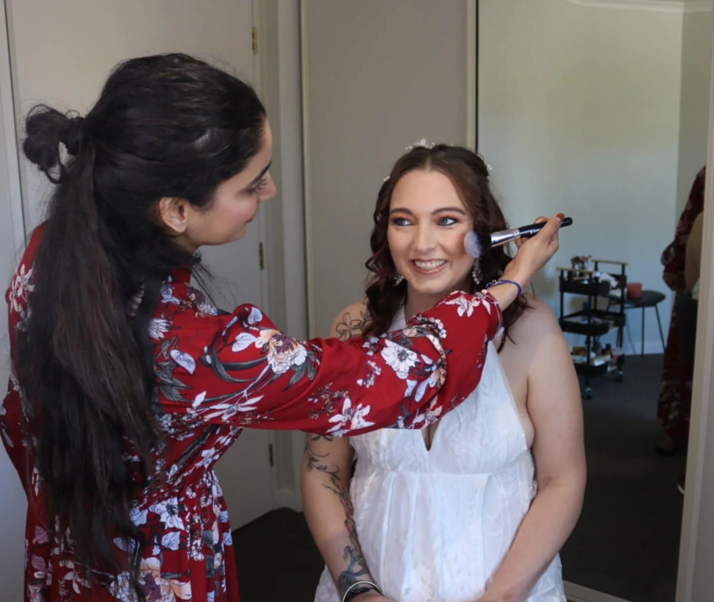 Makeup artist applying finishing touches