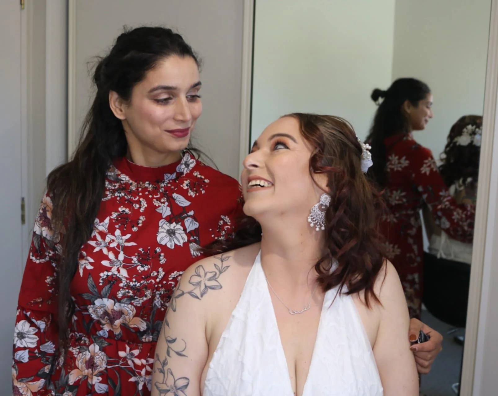 Bride laughing during makeup prep