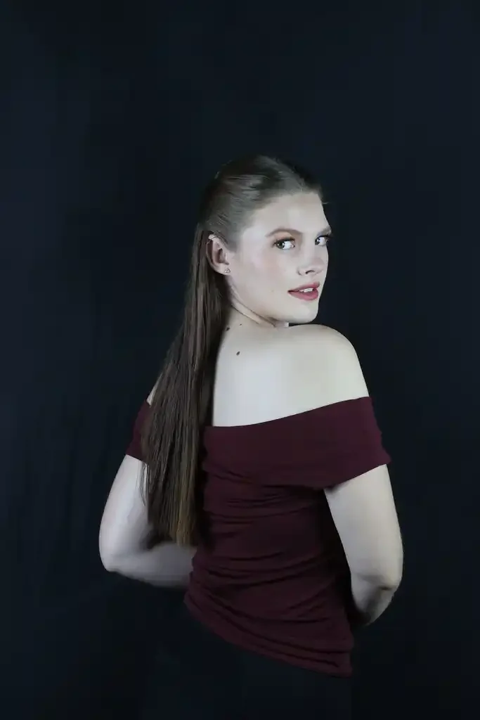Editorial evening makeup portrait on black background